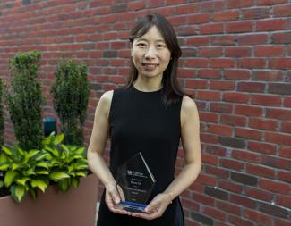 Biyun Xie holding 2026 Faculty Award outside 
